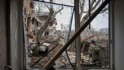 Gorenka: Andrey Goncharuk, 68, a member of territorial defense wipes his face in the backyard of a house that was damaged by a Russian airstrike. AP/PTI(AP03_03_2022_000006A) (AP) Gorenka: Andrey Goncharuk, 68, a member of territorial defense wipes his face in the backyard of a house that was damaged by a Russian airstrike. AP/PTI(AP03_03_2022_000006A) (AP)