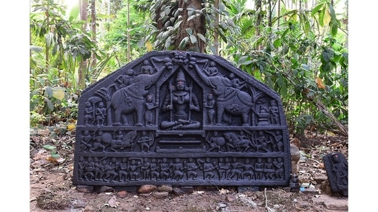 This stone icon with a decorative panel depicting the goddess Gajalakshmi sits in a sacred grove in Kudshe village, Sattari. It finds mention in photographer Pantaleão Fernandes’s latest book, Outdoor Museums of Goa, which focuses on forgotten historical artefacts that dot the state.&nbsp;(Photo courtesy Pantaleão Fernandes)