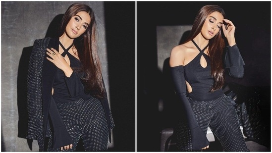 Pooja Hegde is currently busy with the promotions of her film Radhe Shyam which is set to release on March 11. For a recent promotional event, the actor opted for a bold look and donned a shimmery black pantsuit.(Instagram/@hegdepooja)