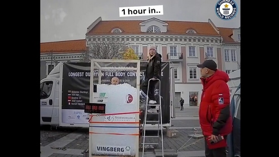 The image, taken from the Instagram video posted by Guinness World Records, shows the man sitting in an ice-filled box.(Instagram/@guinnessworldrecords)