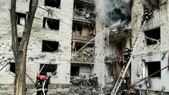 This grab made from a handout video released by the State Emergency Service of Ukraine, shows a damaged apartment building which is said was hit by shelling in Chernihiv.(AFP)