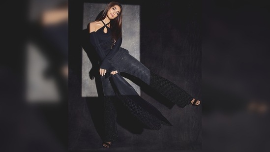 Holding her blazer with one hand and lifting her leg up, Pooja Hegde gave a playful pose for the camera.(Instagram/@hegdepooja)