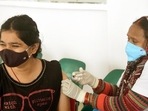 A health worker administers a dose of Covid vaccine in Patna. A health worker administers a dose of Covid vaccine in Patna.