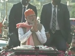 Prime Minister Narendra Modi greets supporters during his roadshow in Varanasi(Twitter/BJP)