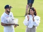 Indian cricketer Virat Kohli with wife Anushka after being honoured by the Punjab Cricket Association (PCA) for becoming the 13th Indian cricketer to play 100 Test matches, at IS Bindra PCA Stadium, Mohali.