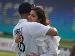 Anushka Sharma and Virat Kohli embrace during his felicitation ahead of his 100th Test match.