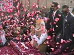 Prime Minister Narendra Modi greets supporters during a roadshow for the seventh and last phase of UP Assembly elections, in Varanasi, Friday,&nbsp;