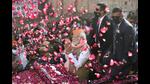 •Prime Minister Narendra Modi greets supporters during a roadshow for the seventh and last phase of UP Assembly elections, in Varanasi, Friday, (PTI Photo) •Prime Minister Narendra Modi greets supporters during a roadshow for the seventh and last phase of UP Assembly elections, in Varanasi, Friday, (PTI Photo)