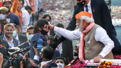 Prime Minister Narendra Modi at a road show in Varanasi on Friday (ANI)