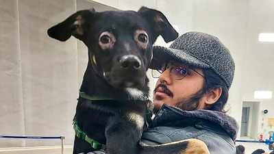 Rishabh Kaushik, evacuated from crisis-hit Ukraine, arrives with his pet dog at the Hindon Air Force Station, in Ghaziabad. (PTI via Twitter)