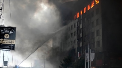 Firefighters hose down a burning building after bombing in Kyiv, Ukraine, Thursday, (AP) Firefighters hose down a burning building after bombing in Kyiv, Ukraine, Thursday, (AP)