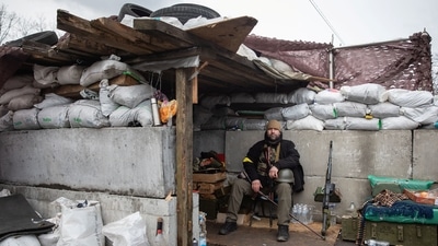A member of Ukraine's Territorial Defence Forces is seen at a checkpoint, amid the Russian invasion of Ukraine, in Kyiv, Ukraine. (REUTERS)