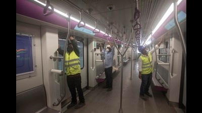 Men work inside a Metro coach at a car depot at Kothrud ahead of the inauguration of Pune Metro. (Pratham Gokhale/HT Photo) Men work inside a Metro coach at a car depot at Kothrud ahead of the inauguration of Pune Metro. (Pratham Gokhale/HT Photo)