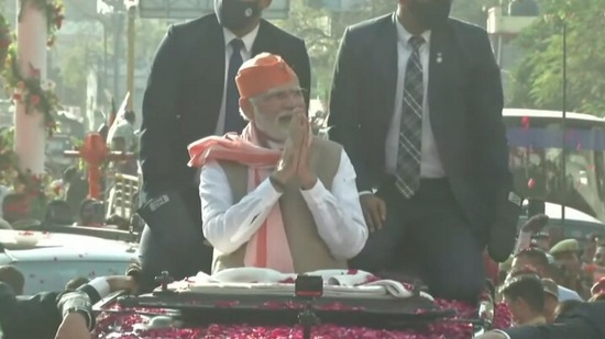 Prime Minister Narendra Modi greets supporters during his roadshow in Varanasi(Twitter/BJP)