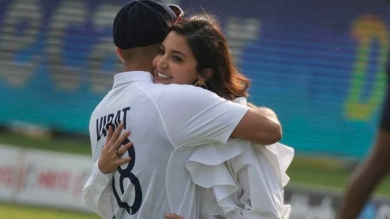 Anushka Sharma and Virat Kohli embrace during his felicitation ahead of his 100th Test match.