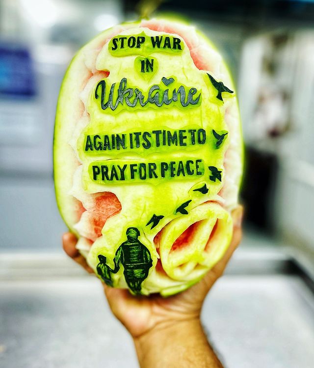 Delhi-based chef Jitender Singh prayed for peace by carving a message on a watermelon. Delhi-based chef Jitender Singh prayed for peace by carving a message on a watermelon.
