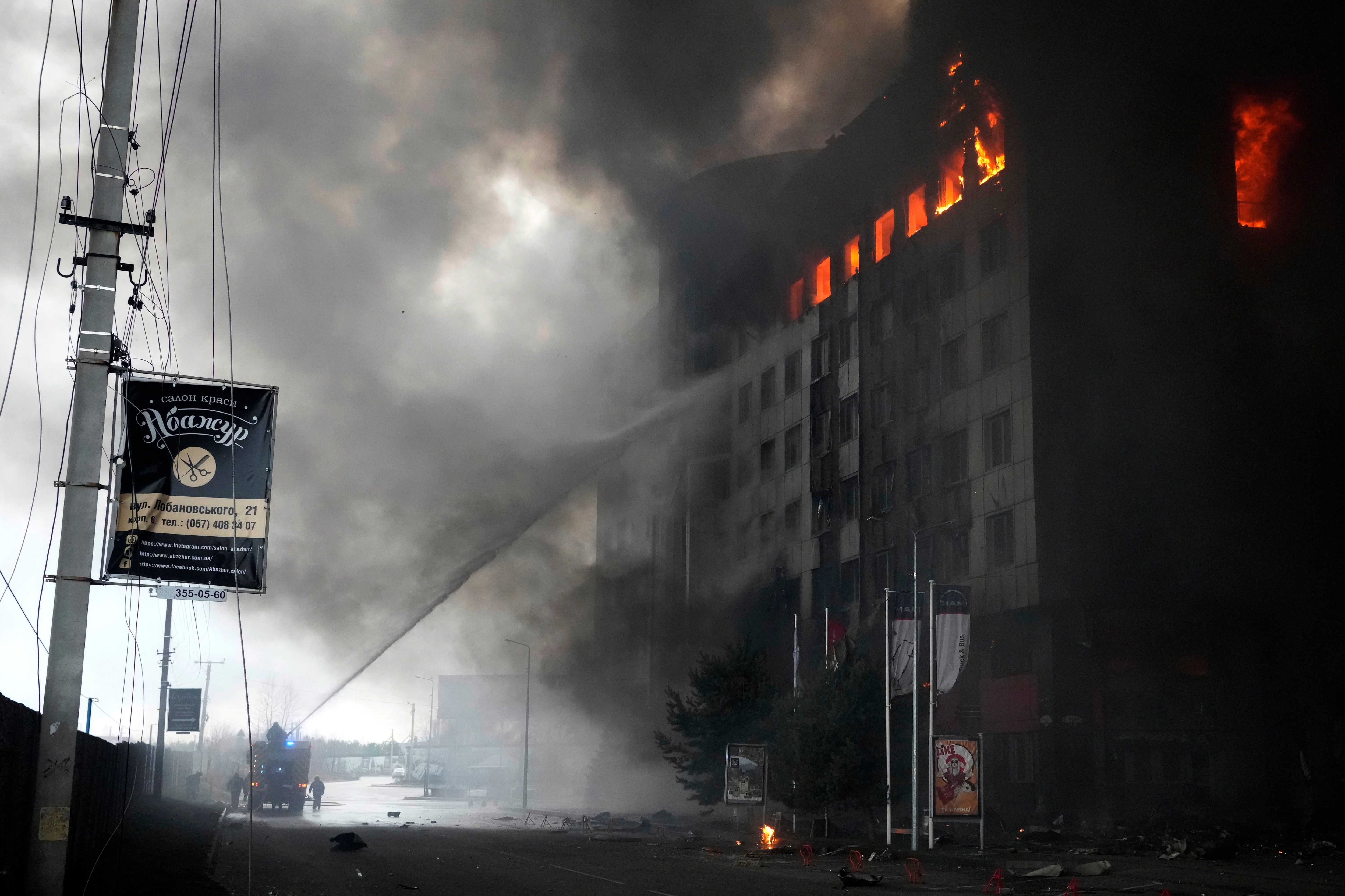 Firefighters hose down a burning building after bombing in Kyiv, Ukraine, Thursday, March 3, 2022. (AP Photo) Firefighters hose down a burning building after bombing in Kyiv, Ukraine, Thursday, March 3, 2022. (AP Photo)