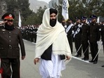 Taliban acting Interior Minister Sirajuddin Haqqani, center, reviews new Afghan police recruits during a graduation ceremony at the police academy in Kabul, Afghanistan. Taliban acting Interior Minister Sirajuddin Haqqani, center, reviews new Afghan police recruits during a graduation ceremony at the police academy in Kabul, Afghanistan.