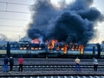 Meerut: Flames rise after a fire broke out in the Saharanpur-Delhi passenger train, at the Daurala railway station in Meerut, Saturday. Meerut: Flames rise after a fire broke out in the Saharanpur-Delhi passenger train, at the Daurala railway station in Meerut, Saturday.