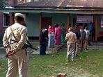Police personnel stand guard while voters wait in a queue to cast their votes for the first phase of Manipur Assembly elections, at a polling booth, in Kangpokpi.(ANI) Police personnel stand guard while voters wait in a queue to cast their votes for the first phase of Manipur Assembly elections, at a polling booth, in Kangpokpi.(ANI)