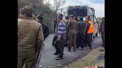 Police at the accident spot near Mansar on Samba-Udhampur Road in Samba district on Saturday. (PTI)