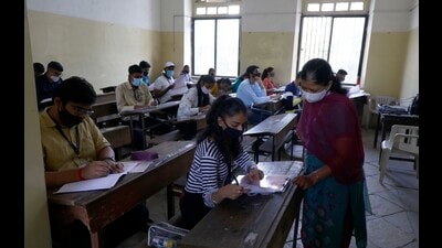 The theory exams of Maharashtra State Board Higher Secondary Certificate (HSC) Class 12, began on Friday as students appeared for the English paper while following the Covid-19 guidelines. (Rahul Raut/HT PHOTO) The theory exams of Maharashtra State Board Higher Secondary Certificate (HSC) Class 12, began on Friday as students appeared for the English paper while following the Covid-19 guidelines. (Rahul Raut/HT PHOTO)