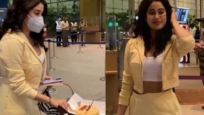 Janhvi Kapoor was clicked cutting a pre-birthday cake with the paparazzi at Mumbai Airport. Janhvi Kapoor was clicked cutting a pre-birthday cake with the paparazzi at Mumbai Airport.