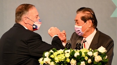 Former US secretary of state Mike Pompeo (L) bumps fists with former Taiwan foreign minister Mark Chen before delivering a speech in Taipei. (AFP) Former US secretary of state Mike Pompeo (L) bumps fists with former Taiwan foreign minister Mark Chen before delivering a speech in Taipei. (AFP)