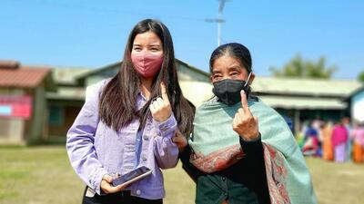 Women show their fingers marked with indelible ink after casting their vote during the second phase of Manipur Assembly elections, Saturday, March 5, 2022. (PTI Photo) Women show their fingers marked with indelible ink after casting their vote during the second phase of Manipur Assembly elections, Saturday, March 5, 2022. (PTI Photo)