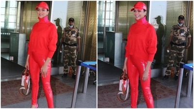 Deepika's outfit for the airport look features a cropped sweater with ribbed details on the neckline, hem, shoulders and cuffs, drooping long sleeves, a baggy fit, a high low waist, and a high-rise turtle neckline with pink stripes. (HT Photo/Varinder Chawla) Deepika's outfit for the airport look features a cropped sweater with ribbed details on the neckline, hem, shoulders and cuffs, drooping long sleeves, a baggy fit, a high low waist, and a high-rise turtle neckline with pink stripes. (HT Photo/Varinder Chawla)