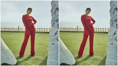Pooja paired a full-sleeved red top with frills with a pair of red satin trousers with wide legs. (Instagram/@hedgepooja)