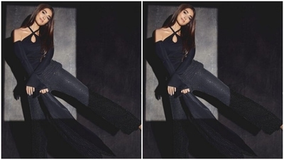 Pooja served the party look in a black top, black glittery blazer and a pair of shimmery black trousers with wide legs. (Instagram/@hedgepooja)