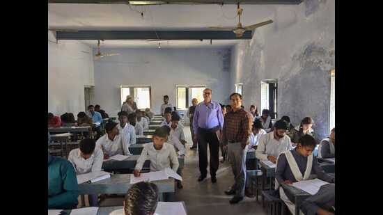 Chhatrapati Shahu Ji Maharaj University Pro-V-C Prof Sudhir Kumar Awasthi and director of CDC, RK Dwivedi, inspecting an examination centre. (HT)