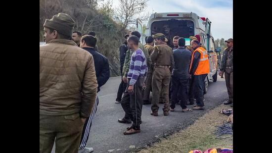 Police at the accident spot near Mansar on Samba-Udhampur Road in Samba district on Saturday. (PTI)