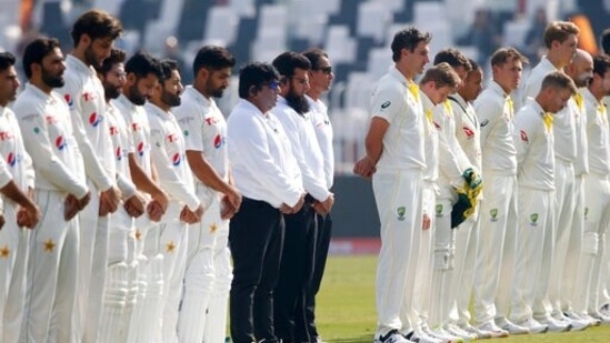 Umpires and players observe a minute's silence.(AP)