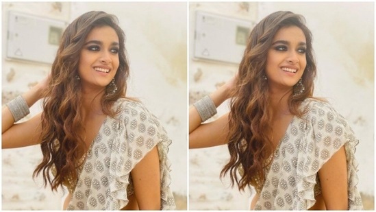 Styled by fashion stylist Archa Mehta, Keerthy wore her tresses open in wavy curls with a side part.(Instagram/@keerthysureshofficial)