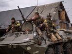 Kyiv: Ukrainian soldiers drive on an armored military vehicle in the outskirts of Kyiv, (AP) Kyiv: Ukrainian soldiers drive on an armored military vehicle in the outskirts of Kyiv, (AP)