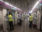 Men work inside a Metro coach at a car depot at Kothrud ahead of the inauguration of Pune Metro. (Pratham Gokhale/HT Photo) Men work inside a Metro coach at a car depot at Kothrud ahead of the inauguration of Pune Metro. (Pratham Gokhale/HT Photo)
