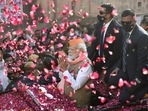 Prime Minister Narendra Modi greets supporters during a roadshow for the seventh and last phase of UP Assembly elections, in Varanasi, Friday,&nbsp;