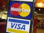 Credit cards issued by Russian banks using the Visa and Mastercard payment systems will stop functioning overseas after March 9.(AP File Photo) Credit cards issued by Russian banks using the Visa and Mastercard payment systems will stop functioning overseas after March 9.(AP File Photo)