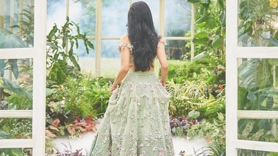 It was teamed with a matching pastel green lehenga that too came with multi-coloured floral cut-outs embroidered all over along with intricate embroidery designs. Embellished with over 1,00,000 beads, sequins, crystals and rhinestones, the beautiful lehenga from Krésha Bajaj took 20,000 hours to make over a period of 6 months and was embroidered in over 12 colours. (Instagram/rohanshrestha) It was teamed with a matching pastel green lehenga that too came with multi-coloured floral cut-outs embroidered all over along with intricate embroidery designs. Embellished with over 1,00,000 beads, sequins, crystals and rhinestones, the beautiful lehenga from Krésha Bajaj took 20,000 hours to make over a period of 6 months and was embroidered in over 12 colours. (Instagram/rohanshrestha)
