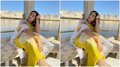 Disha teamed the ensemble with minimal accessories, including a pair of rani pink embroidered juttis, a metallic watch, rings, and layered gold jhumkis with colourful accents. Side parted open tresses completed the star's hairdo. (Instagram/@dishaparmar) Disha teamed the ensemble with minimal accessories, including a pair of rani pink embroidered juttis, a metallic watch, rings, and layered gold jhumkis with colourful accents. Side parted open tresses completed the star's hairdo. (Instagram/@dishaparmar)