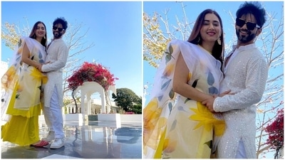Rahul complimented Disha in a white embroidered kurta and pyjama set. The pristine white bandhgala kurta features sequin and thread work, and he teamed it with plain white pants, matching sneakers and sunglasses. (Instagram/@dishaparmar) Rahul complimented Disha in a white embroidered kurta and pyjama set. The pristine white bandhgala kurta features sequin and thread work, and he teamed it with plain white pants, matching sneakers and sunglasses. (Instagram/@dishaparmar)