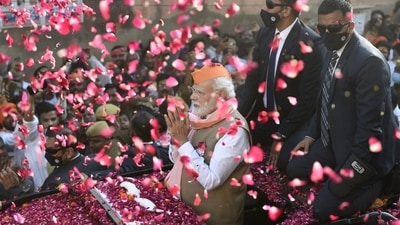 Prime Minister Narendra Modi greets supporters during a roadshow for the seventh and last phase of UP Assembly elections, in Varanasi, Friday, (PTI) Prime Minister Narendra Modi greets supporters during a roadshow for the seventh and last phase of UP Assembly elections, in Varanasi, Friday, (PTI)