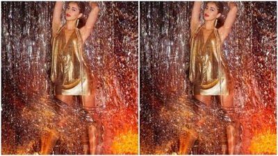 To a shimmery gold short dress, Ananya added gold earrings as accessories and was ready to go to party. (Instagram/@ananyapanday)