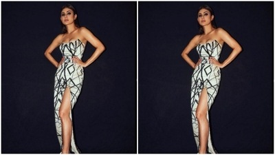 Mouni's off-shoulder gown came in abstract patterns and a bow detail at the waist and one thigh-high slit. (Instagram/@imouniroy)