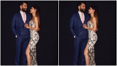 Mouni and Suraj looked perfect together. Suraj decked up in a blue suit while Mouni smiled at her. (Instagram/@imouniroy)