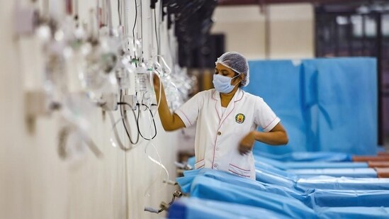A healthworker prepares an 'oxygen triage facility' for Covid-19 patients in Chennai.