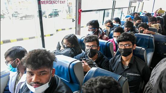 Indian students wait in a bus to leave for their respective places at IGI Airport after being evacuated from war-hit Ukraine, in New Delhi on Sunday. (ANI) Indian students wait in a bus to leave for their respective places at IGI Airport after being evacuated from war-hit Ukraine, in New Delhi on Sunday. (ANI)