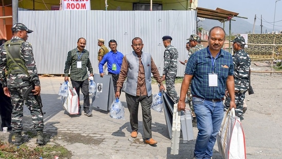 Polling officials carrying election material leave from a distribution centre, ahead of the Assam Municipal polls, in Kamrup district.(PTI)